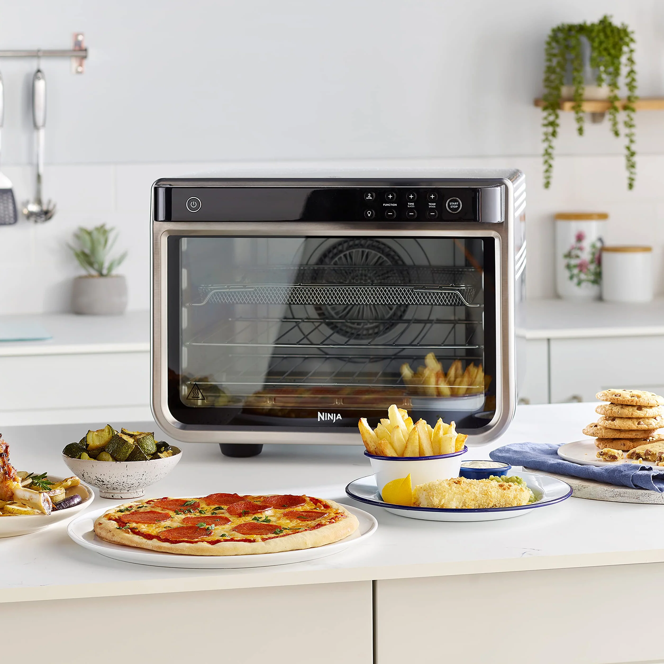 Ninja Foodi Horno multifunción 10 en 1, Mini horno portátil para encimeras y superficies de trabajo, 10 funciones de cocción, Freír con aire, Asar, Parrilla, Hornear y más, en plata y negro, DT200EU