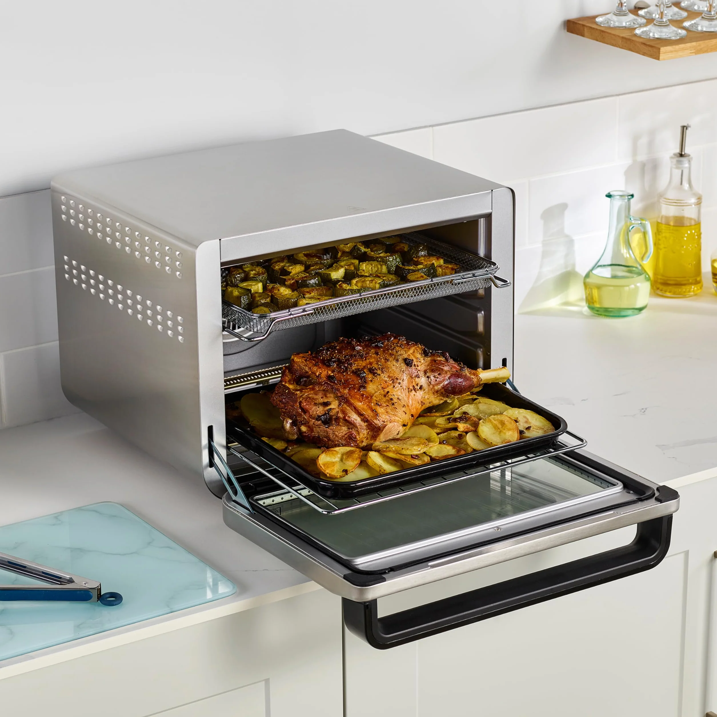 Ninja Foodi Horno multifunción 10 en 1, Mini horno portátil para encimeras y superficies de trabajo, 10 funciones de cocción, Freír con aire, Asar, Parrilla, Hornear y más, en plata y negro, DT200EU
