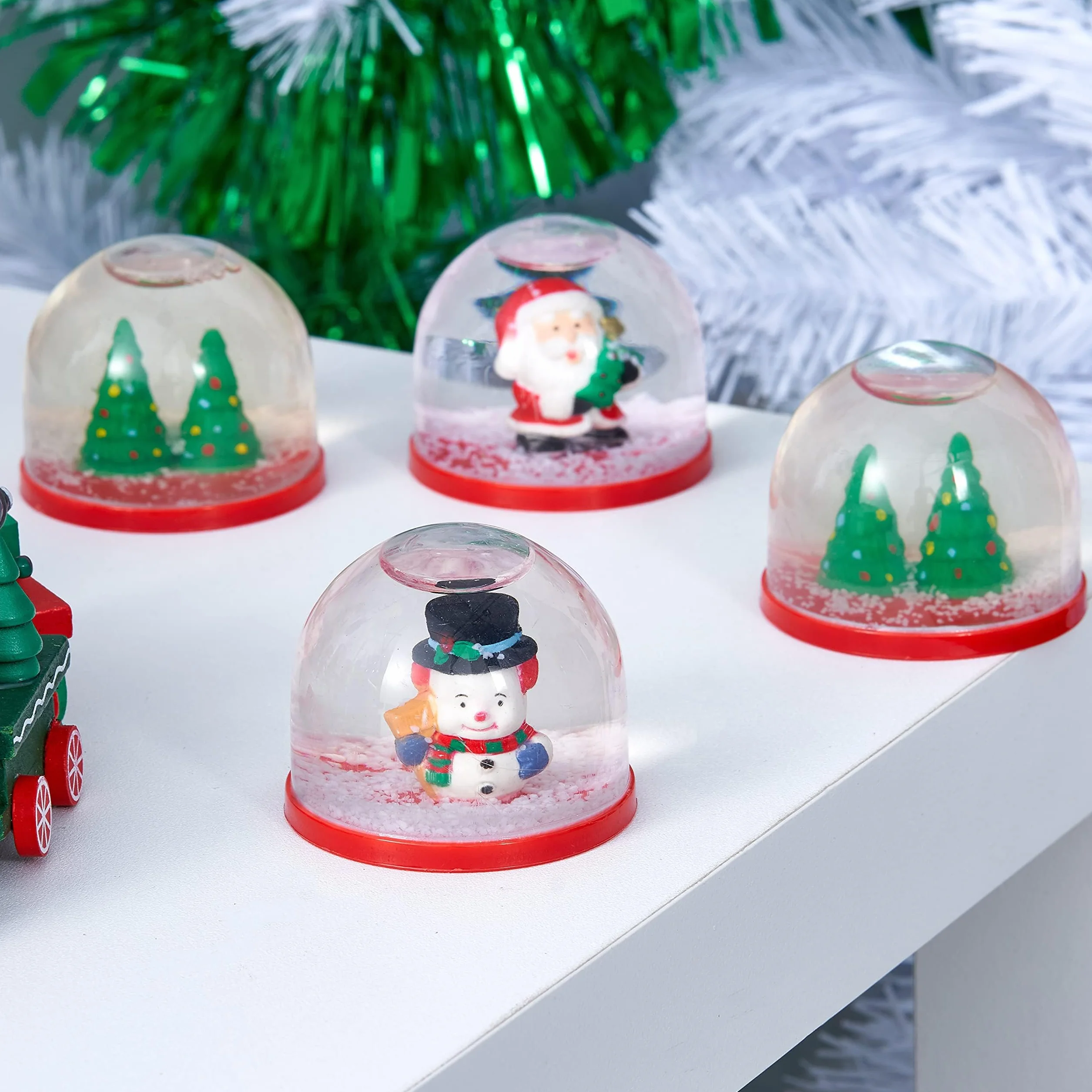 4 Mini Globos de Nieve Navideños 5cm Surtido Diseños Festivos