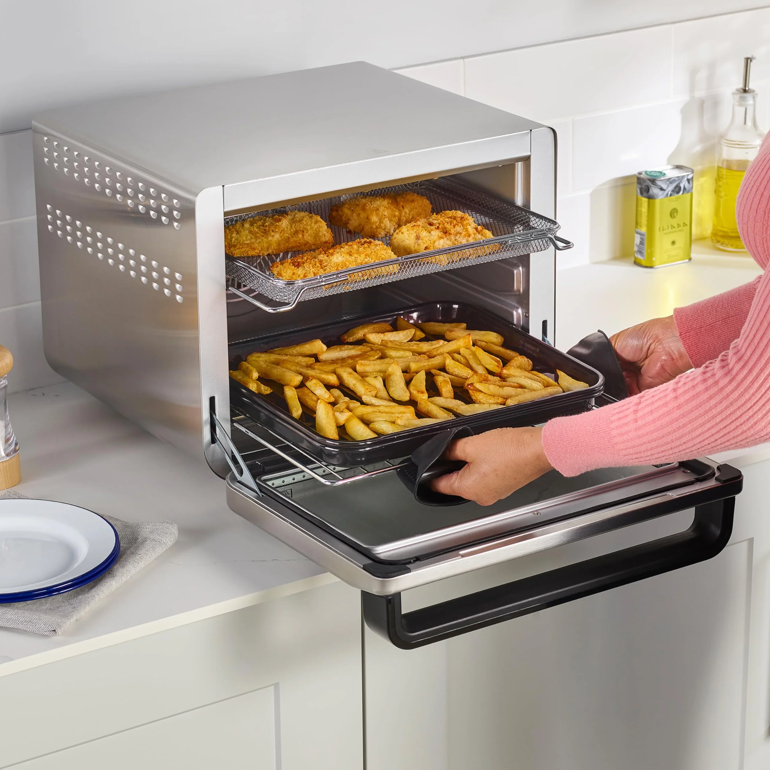Ninja Foodi Horno multifunción 10 en 1, Mini horno portátil para encimeras y superficies de trabajo, 10 funciones de cocción, Freír con aire, Asar, Parrilla, Hornear y más, en plata y negro, DT200EU